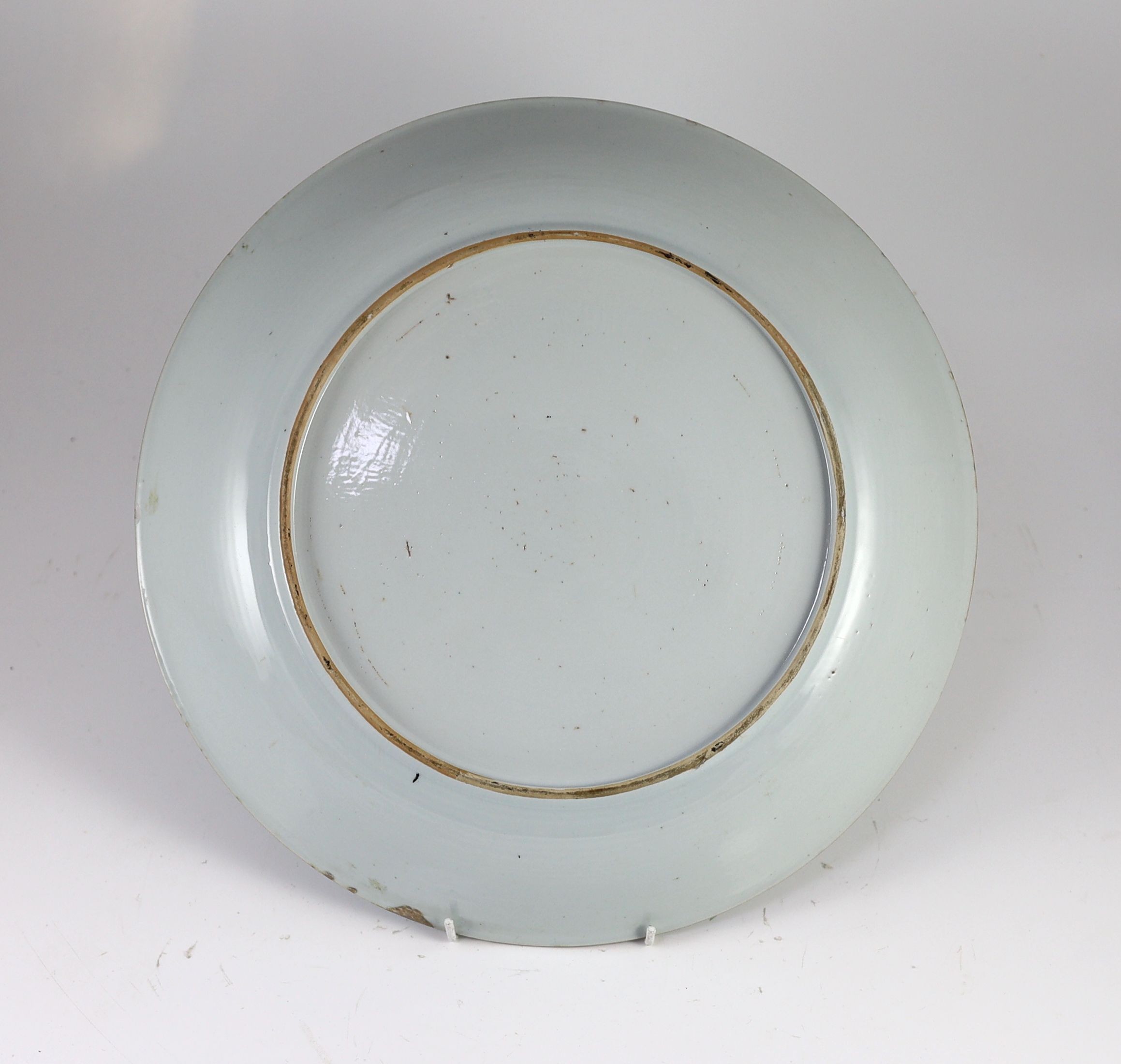 A Chinese carved blue and white dish, Yongzheng period, 39 cm diameter, restored chip